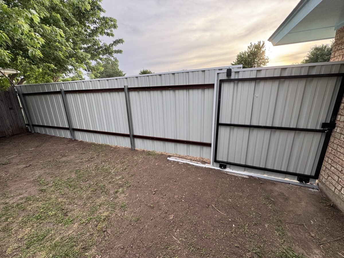 Metal frame gate with steel panels installed by SWY Fencing