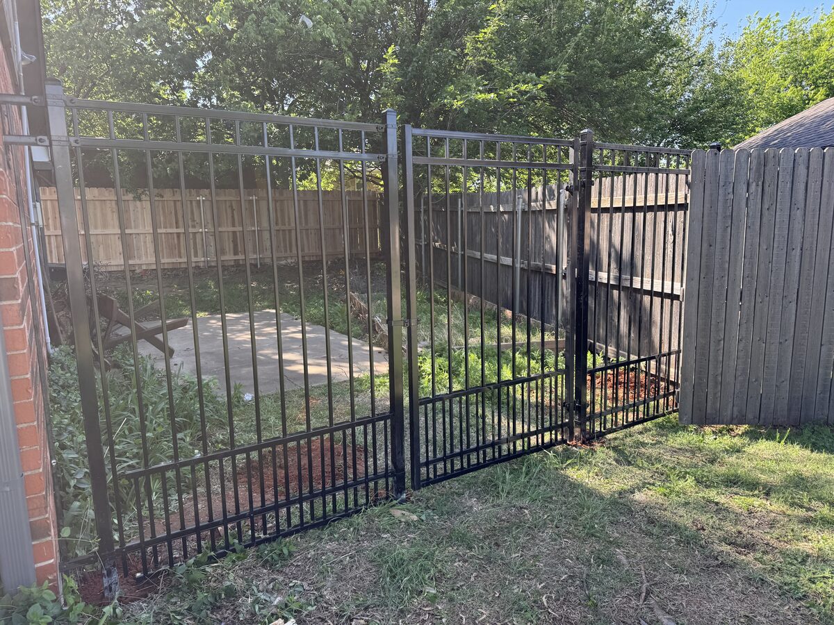 Black wrought iron fence and gate installed by SWY Fencing