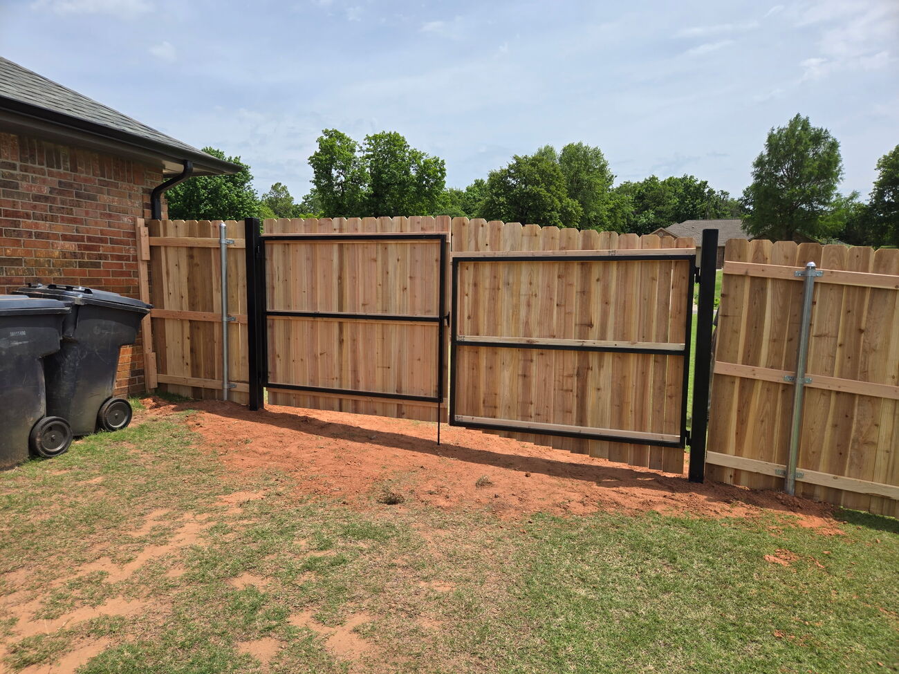 Cedar wood gate at golden hour by SWY Fencing