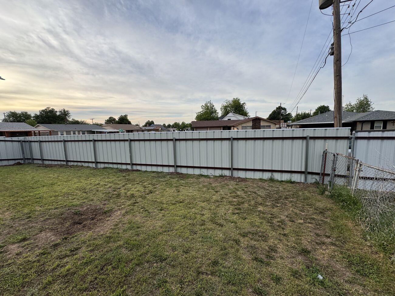 Steel panel privacy fence by SWY Fencing
