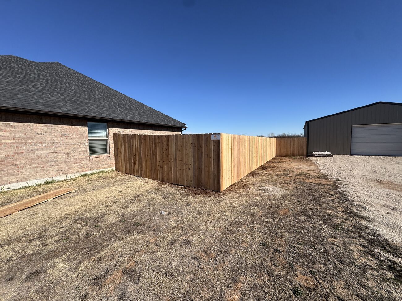 Wood privacy fence in an Oklahoma City backyard by SWY Fencing